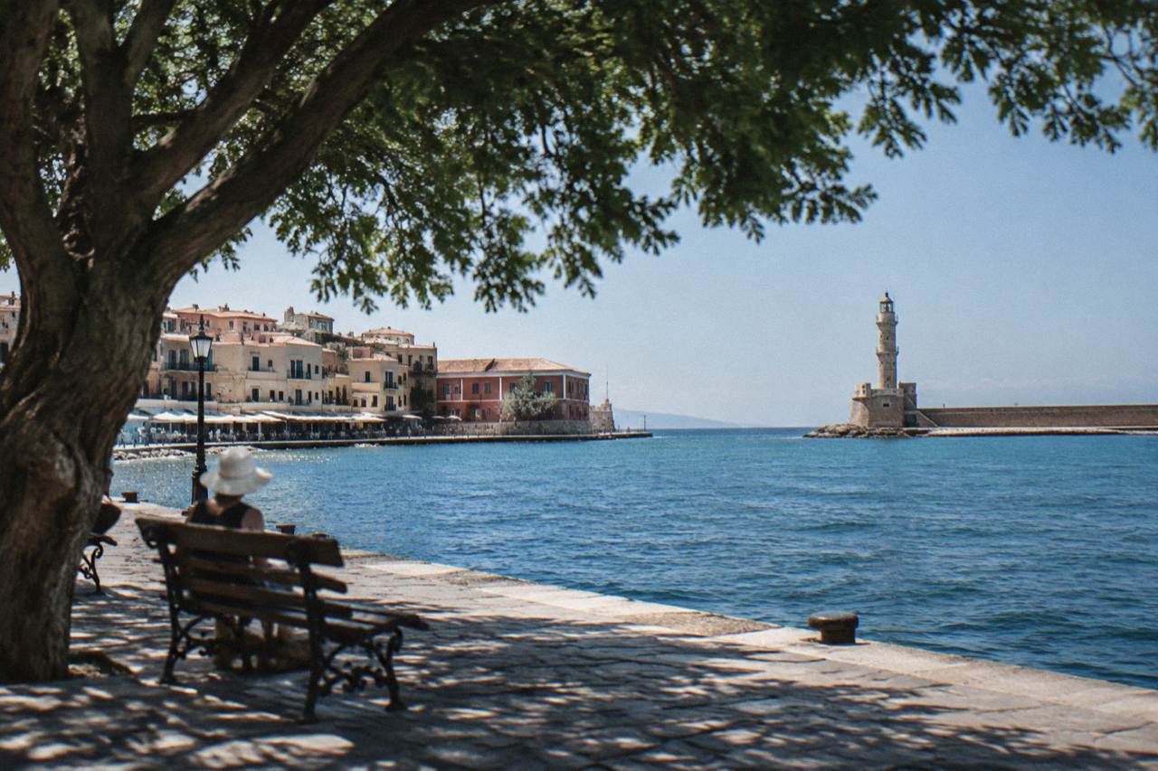 The Venetian Harbour of Chania with its lighthouse and rows of waterfront buildings along the quay