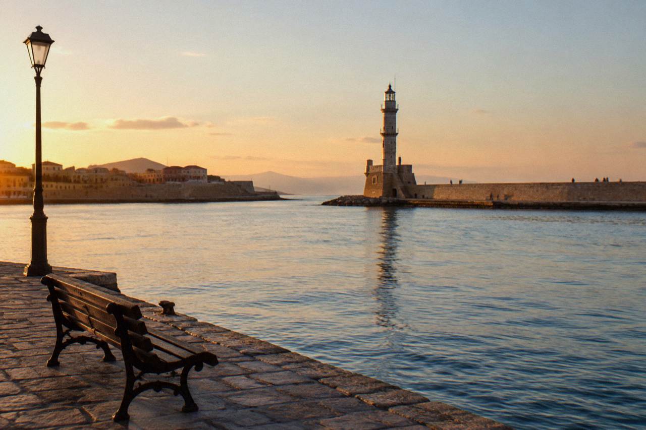 The Venetian Harbour of Chania with its lighthouse in the background on a calm morning