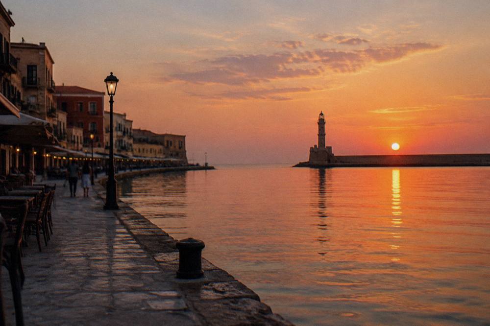 Venetian Harbour front at dusk with the lighthouse in the distance