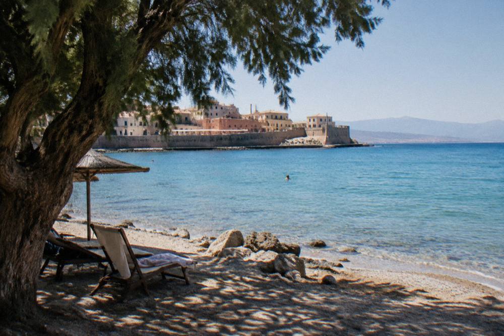 A quiet beach on the north-west coast of Crete with calm turquoise water in the late afternoon