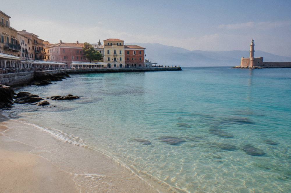 Turquoise shallow water and pale sand at a west Crete lagoon beach