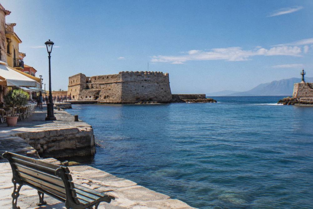 Firka Fortress stone walls at the harbour entrance in Chania with sea beyond