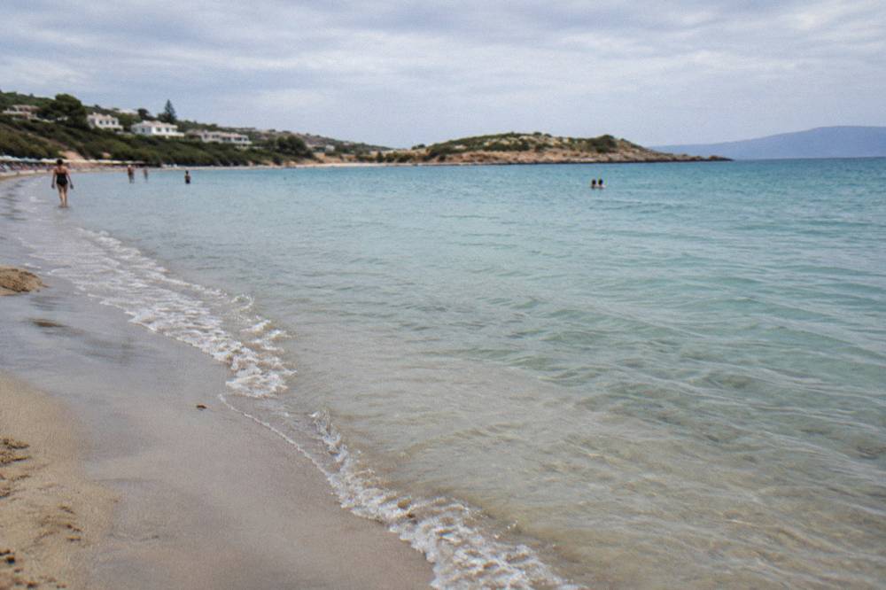 Shallow turquoise water over sand with gentle ripples near the shore