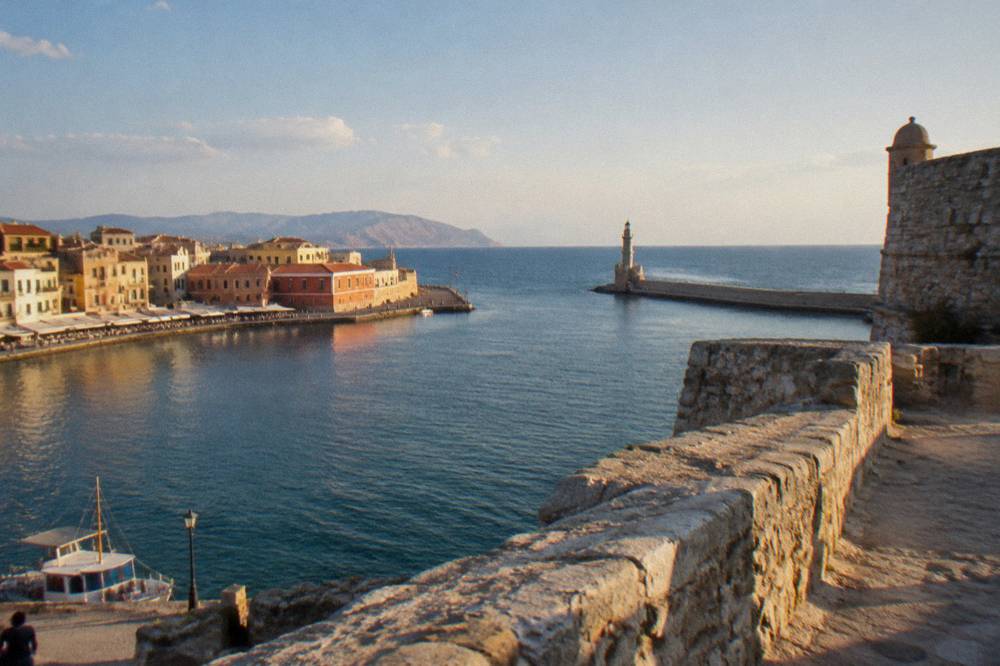 Panorama of the Venetian Harbour in Chania with fortress walls on the right and the sea beyond