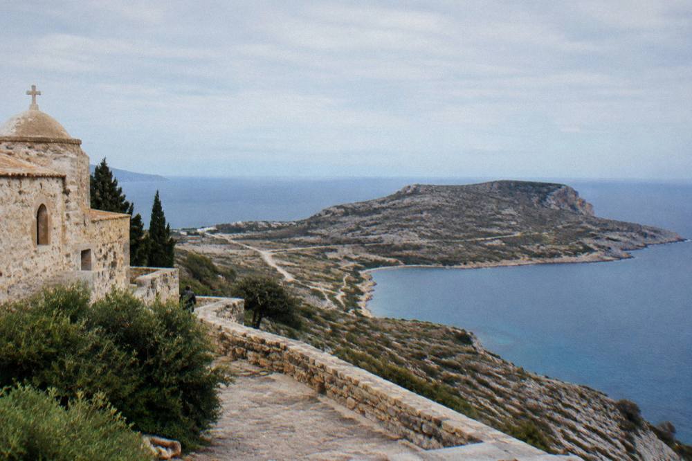 A wide view of the Akrotiri peninsula coastline with the sea horizon beyond