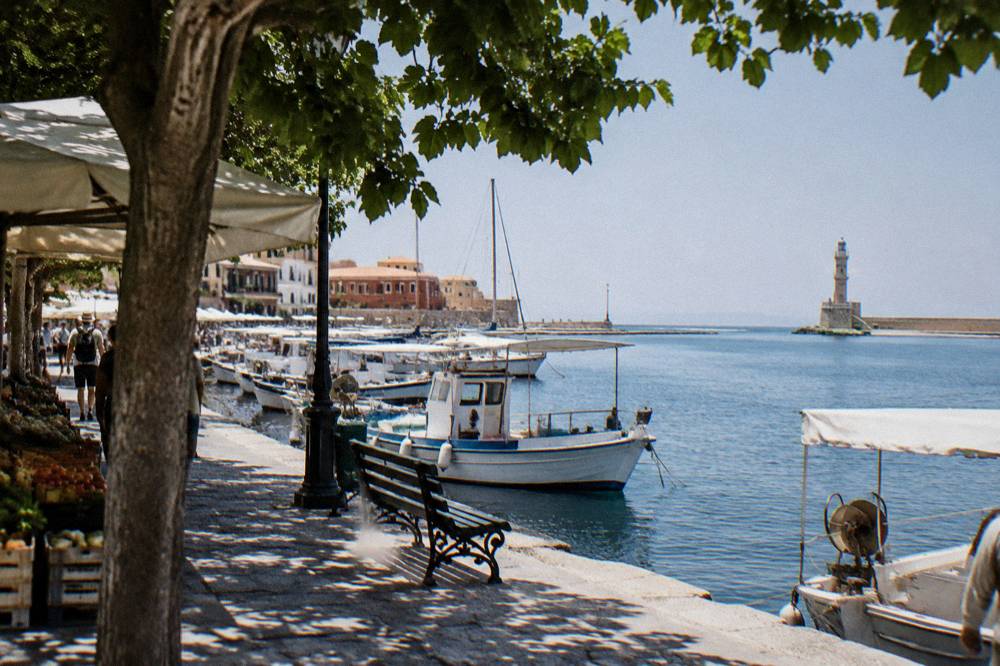 Harbour front at midday with boats moored along the Venetian quay