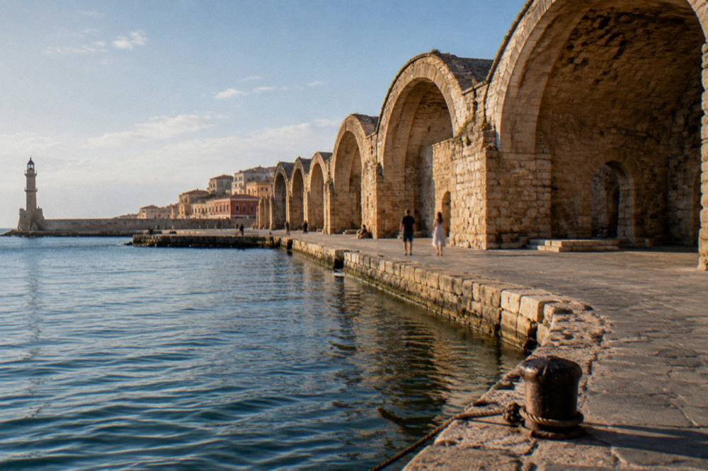 The stone arches of the Venetian Neoria shipyards along the Chania waterfront