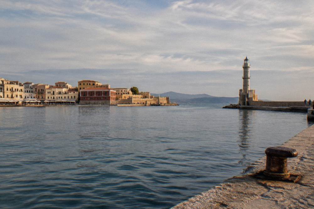 The Venetian Harbour of Chania seen from the mole with the lighthouse beyond