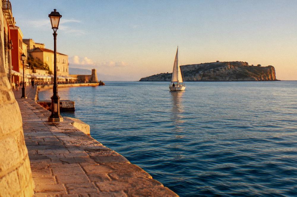 Small sailing boat on calm blue water near an island off the Chania coast