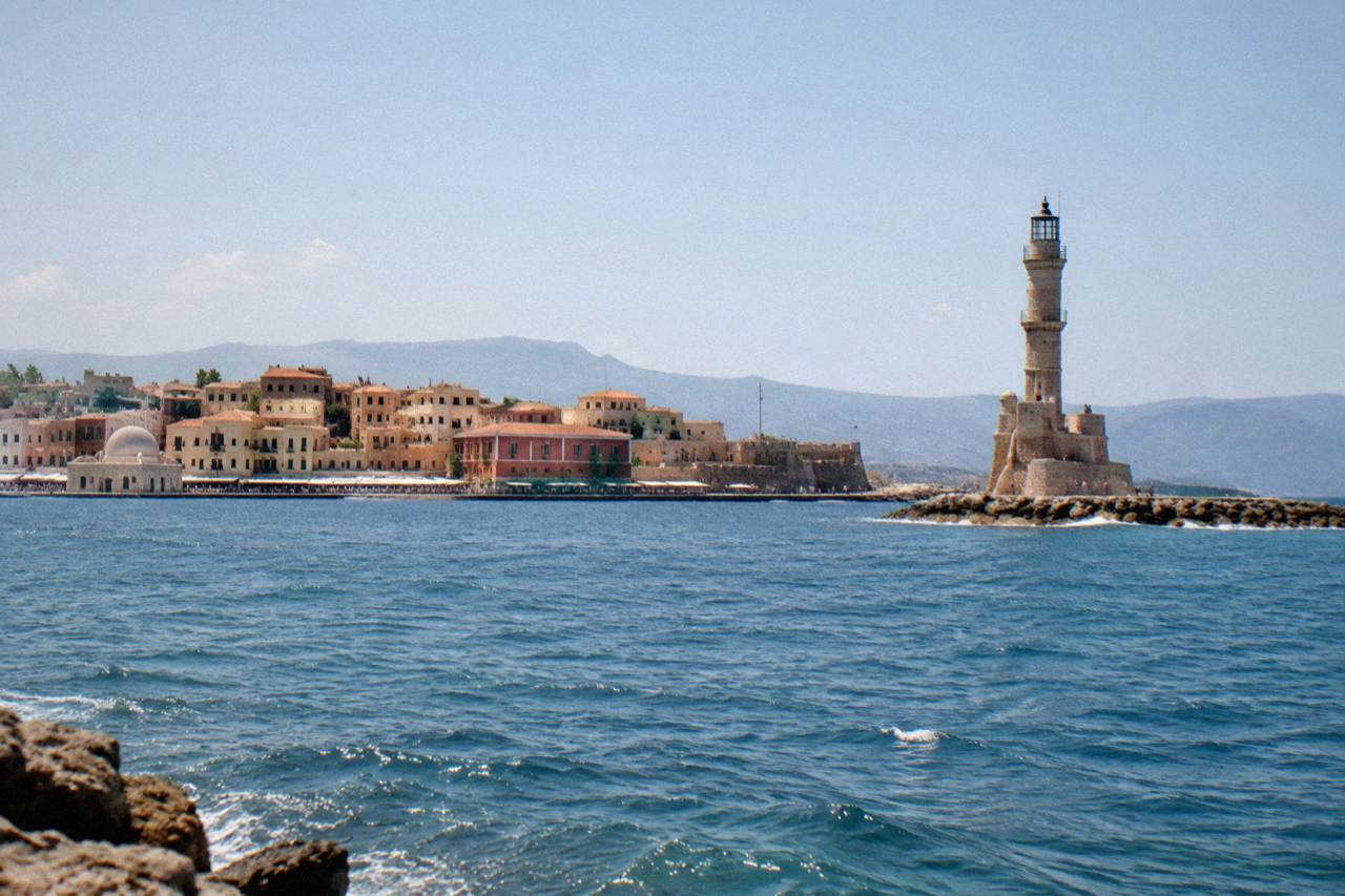 The Venetian Harbour of Chania seen from the sea, with the lighthouse at the end of the mole
