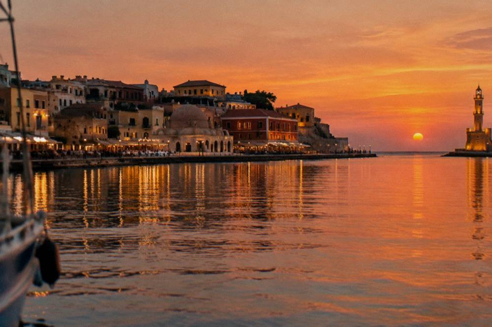 Evening lights of Chania Old Town and the Venetian Harbour seen from the sea
