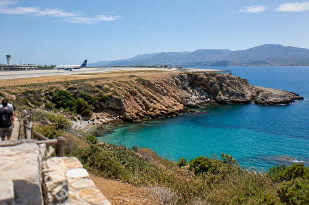 Turquoise water of a small cove on the Akrotiri peninsula with steep rocky sides