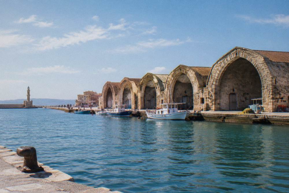 The stone arched sheds of the Neoria shipyards on the Chania harbour waterfront