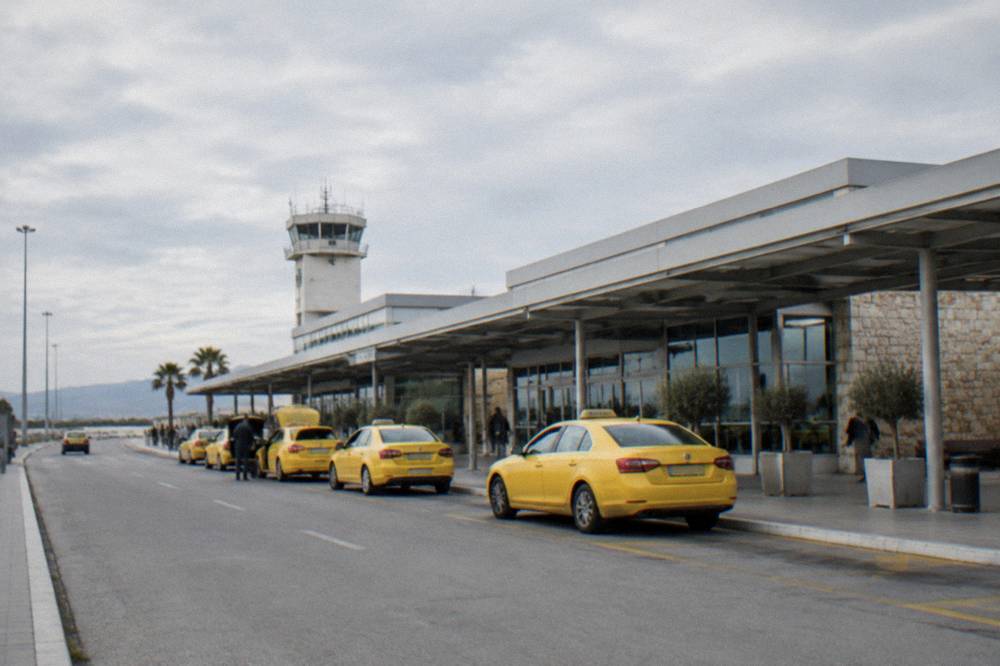 Airport terminal building at Chania airport with taxis waiting outside