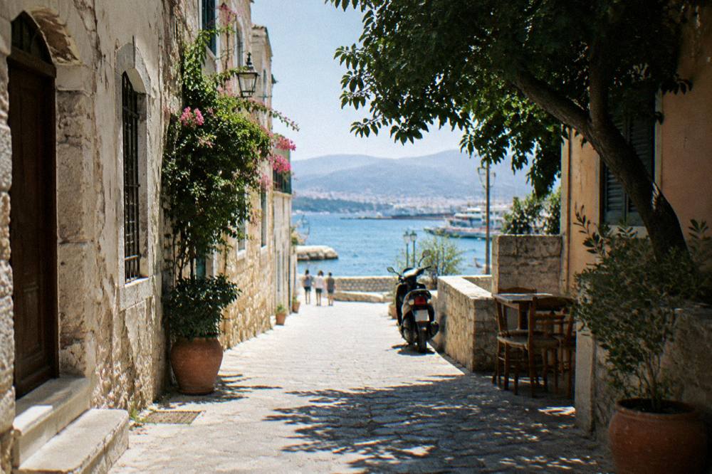 A narrow stone street with old buildings in Chania Old Town