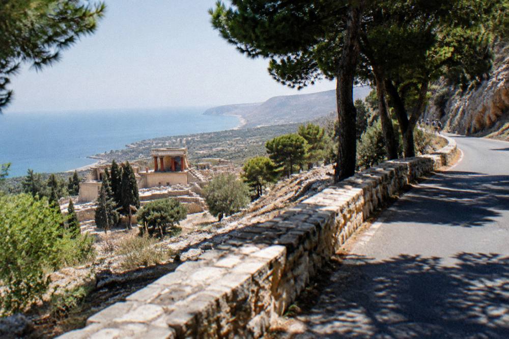A mountain road winding through rocky slopes above the coast of west Crete