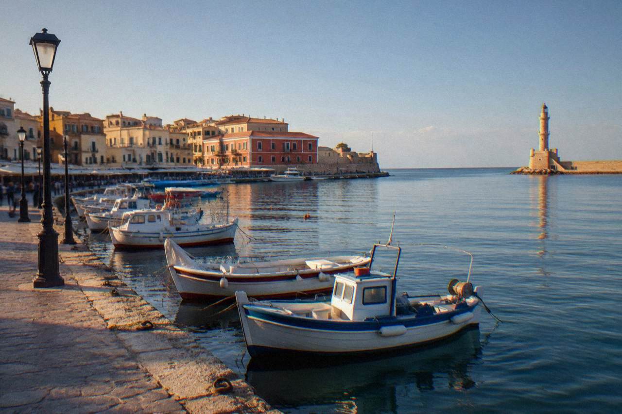 The Venetian Harbour of Chania at calm morning light with boats moored along the quay
