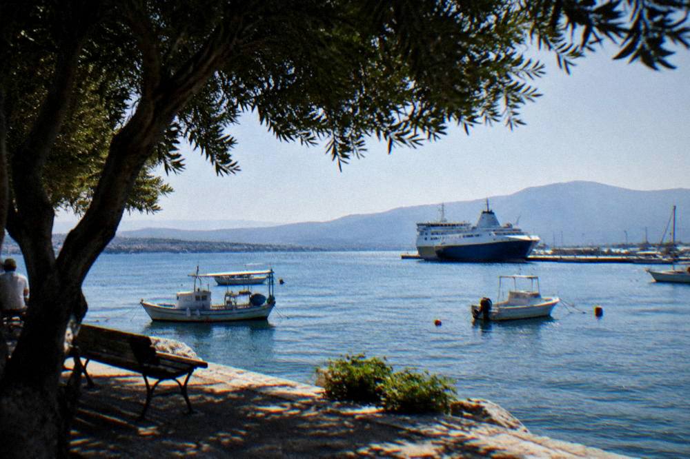 A ferry and small boats in Souda bay near Chania in early morning light