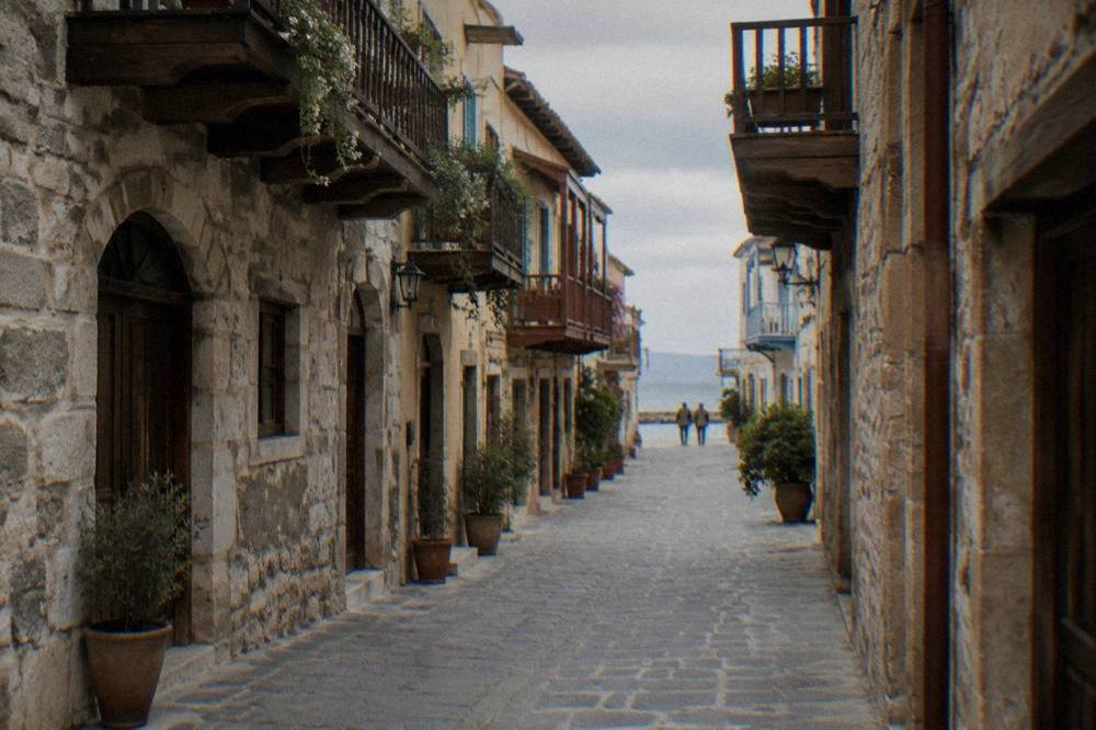 A narrow stone street in Chania Old Town with wooden balconies