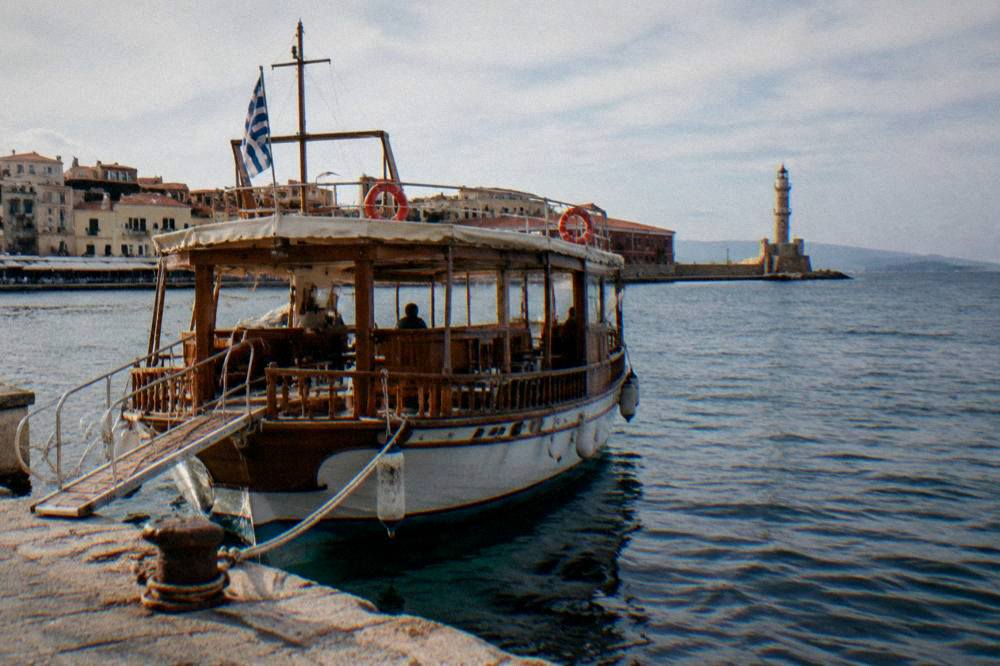 A wooden excursion boat at a quay in Chania harbour