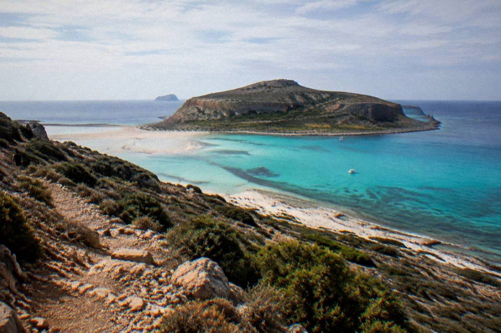 The turquoise lagoon at Balos seen from the cliff path above the beach