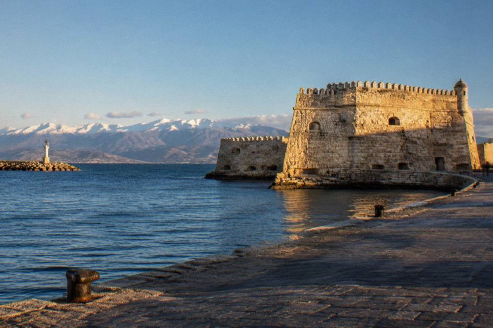 The Venetian fortress at the Chania harbour mouth against a clear winter sky