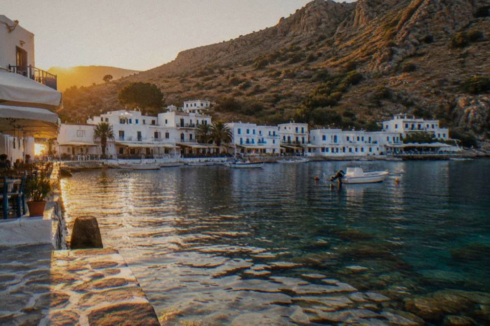 White buildings of Loutro village beside clear water on the south coast of Crete