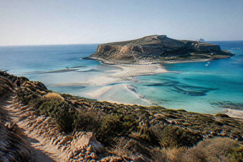 Turquoise shallow water of Balos lagoon seen from the cliff path above the beach