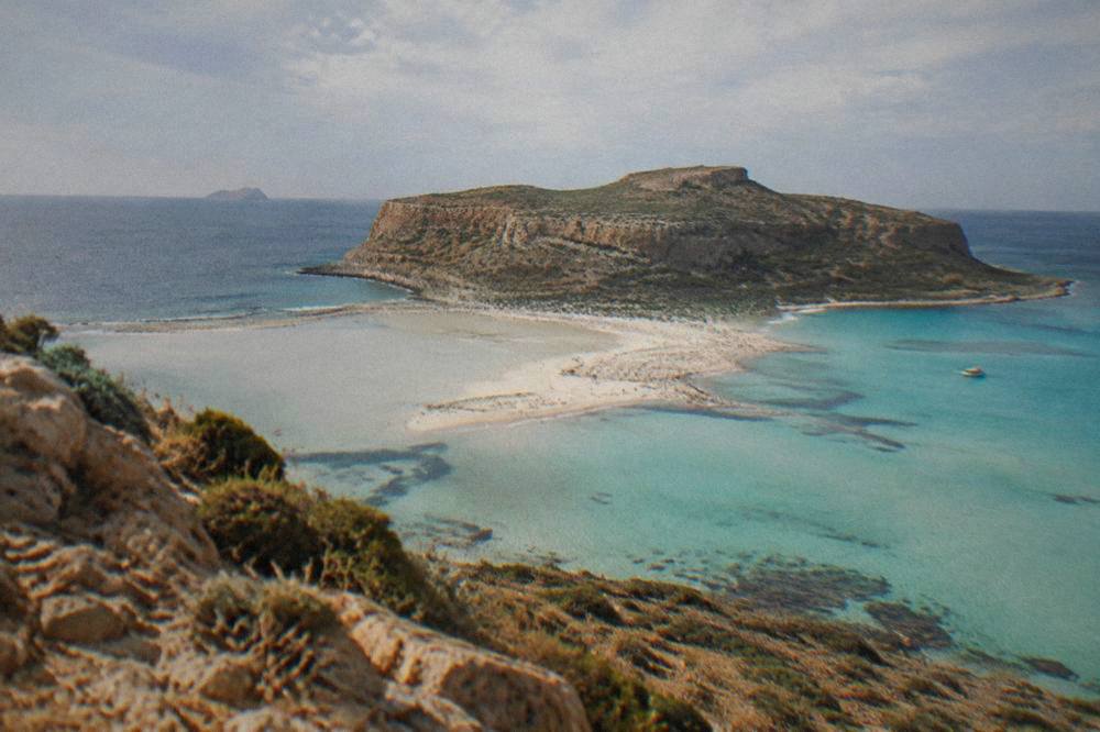 Balos lagoon seen from above with turquoise shallow water and a sand spit