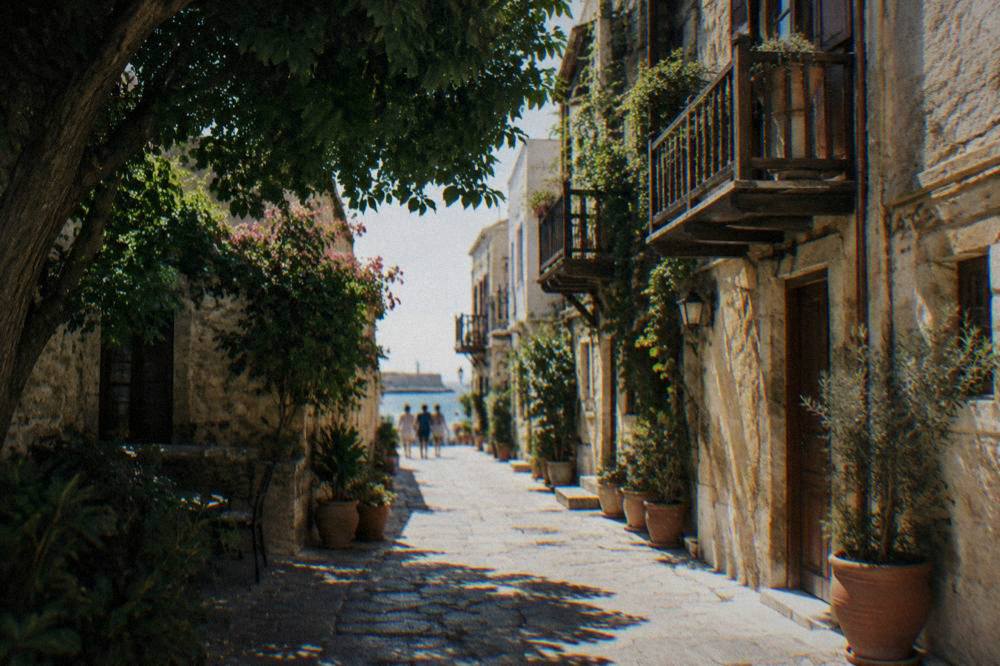 A narrow stone alley in Chania Old Town with wooden balconies and potted plants