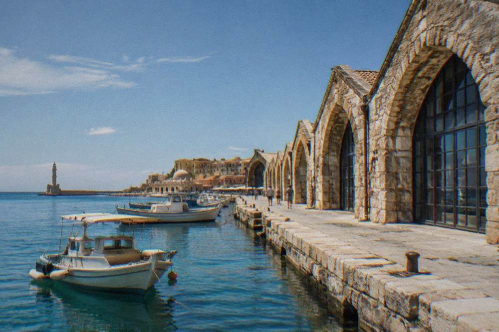 The stone arches of the Neoria shipyard buildings on Chania harbour