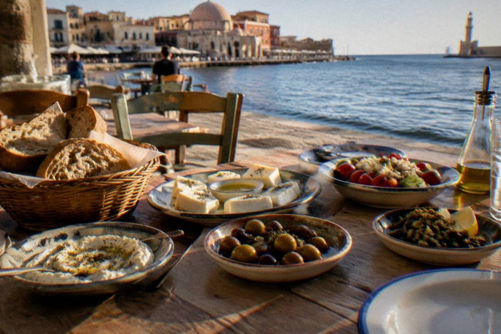 A table of Cretan small dishes with bread, cheese and olive oil