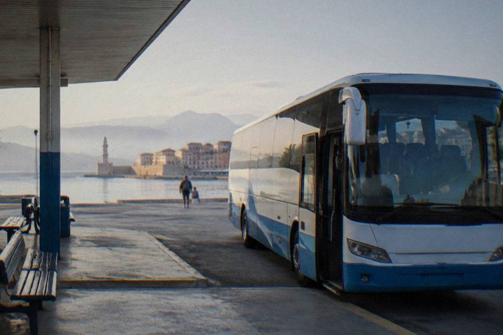 A KTEL bus parked at a small station in Chania