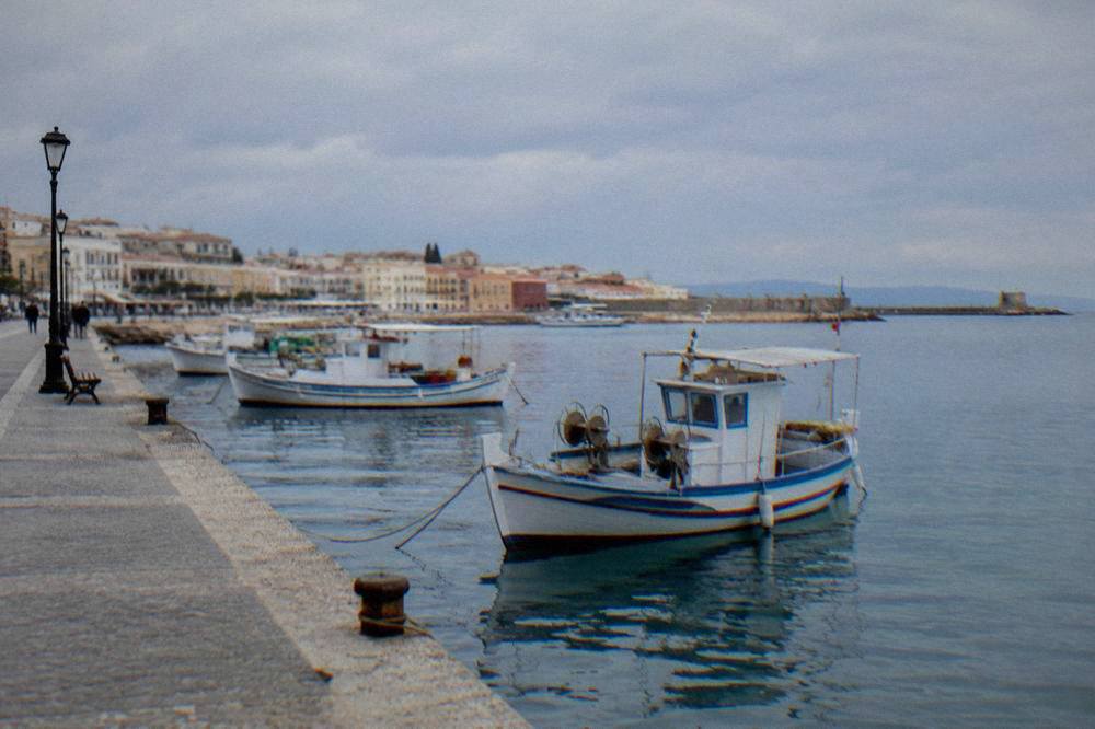 The seafront promenade at Nea Chora with fishing boats near the water